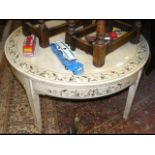 A circular painted coffee table