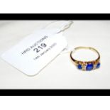 A lady's sapphire and diamond ring in 18ct gold se