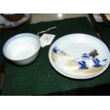 A Nanking Cargo blue and white cup and saucer with