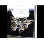 A silver 'butterfly' brooch set with amethysts