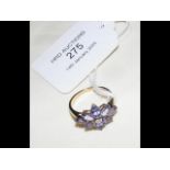 A tanzanite and diamond ring in gold setting