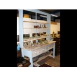 An antique style pine dresser with plate rack over