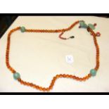 An unusual old amber and jade necklace