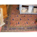 A large Middle Eastern style carpet with geometric