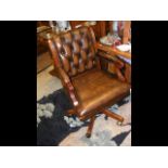 An antique style reproduction office swivel chair