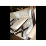 A retro swivel button back wing easy chair with ma