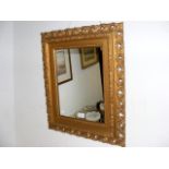 A small antique gilt framed wall mirror - 55cm x 4