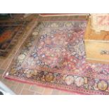 An old Middle Eastern rug with geometric floral bo