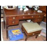 A 19th century mahogany desk with five drawers to the front