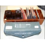 An old Bakelite Viewmaster with reels, together wi