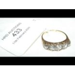 A lady's five stone diamond ring - the centre ston