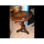 A circular inlaid Victorian occasional table with