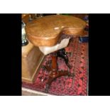 A 19th century kidney shaped walnut worktable