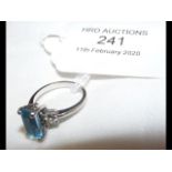 A lady's baguette shaped aquamarine and diamond ri