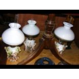 Three decorative ceramic oil lamps with cherub mou