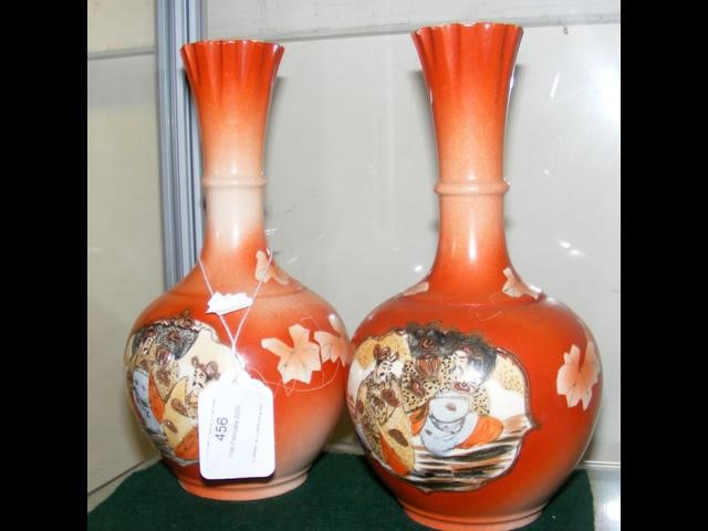 A pair of oriental vases - 21cm high