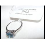 A lady's aquamarine and diamond ring in platinum setting