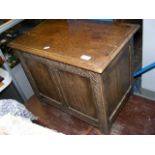 A small oak panelled storage chest - 59cm