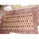 A Middle Eastern rug with geometric border and cen