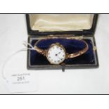 A lady's gold wrist watch in presentation case
