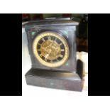 A Victorian slate mantel clock with striking movem