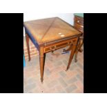 An Edwardian envelope games table with single draw