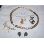 A silver necklace, coral brooch, etc.