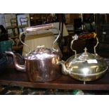 An antique copper kettle, together with a brass di