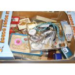 A box containing various collectables, including e