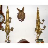 A pair of decorative gilt wall lights of ribbon an