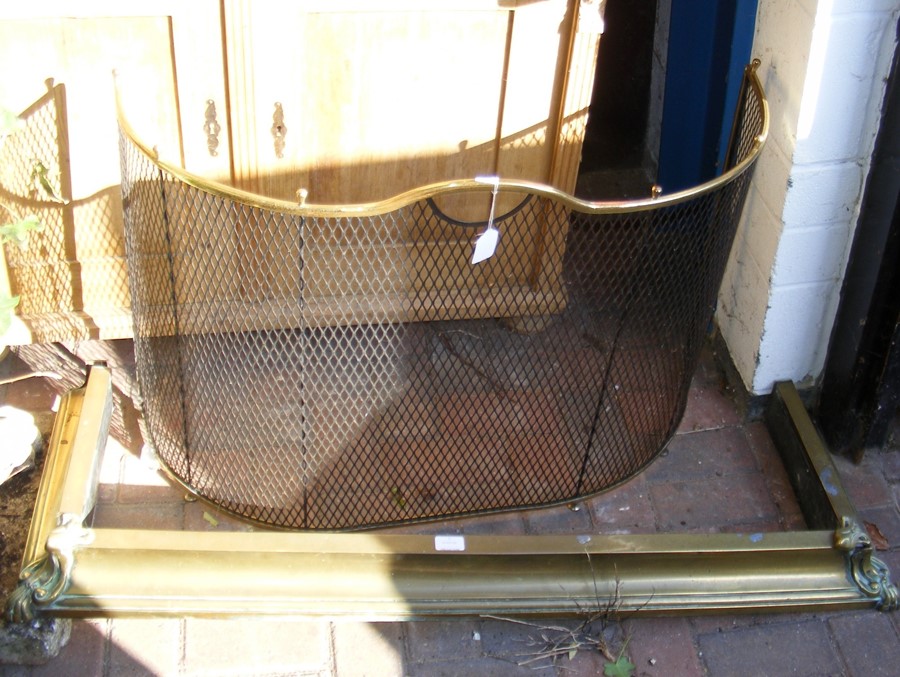 An antique spark guard, together with brass fire f