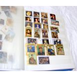 An album containing a collection of art stamps