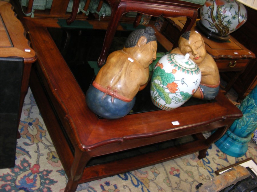 The matching hardwood coffee table with glass inse