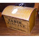 An old tin hand luggage case with label for Union