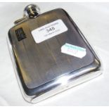 A solid silver hip flask with Sheffield hallmark