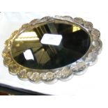 A 20.5cm diameter silver mounted oval mirror