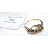 A lady's decorative five stone dress ring in gold
