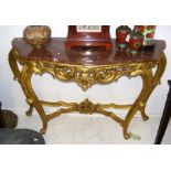 A rouge marble top console table with wooden gilt