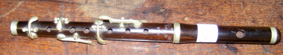 A Miller Browne rosewood marching flute,