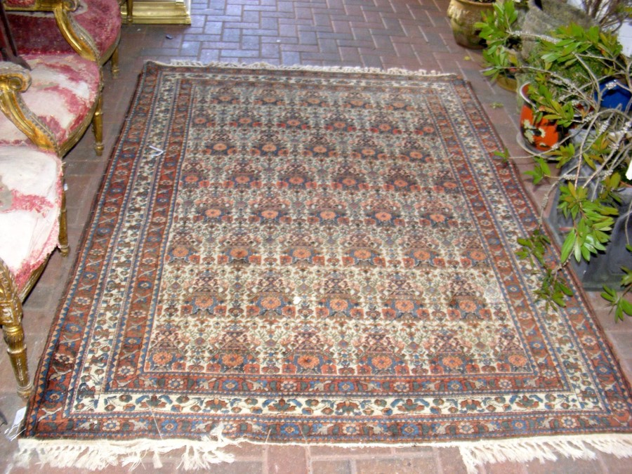 A Middle Eastern style rug with geometric border -