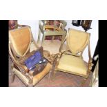 A pair of stylish gilt armchairs