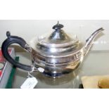 A silver oval teapot