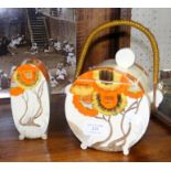 A Clarice Cliff 'Rhodanthe' biscuit barrel, togeth