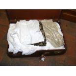 A suitcase containing vintage clothing, some sequi