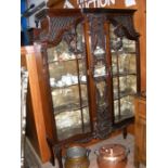 A large Edwardian display cabinet with decorative