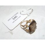 A lady's oval smoky quartz dress ring in 9ct gold