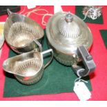 A three piece silver teaset with Sheffield hallmar