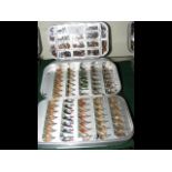 A cased set of fishing flies in Wheatley case and