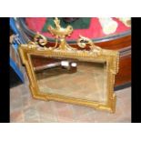 An elegant gilt wall mirror