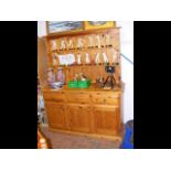 A pine dresser with plate rack